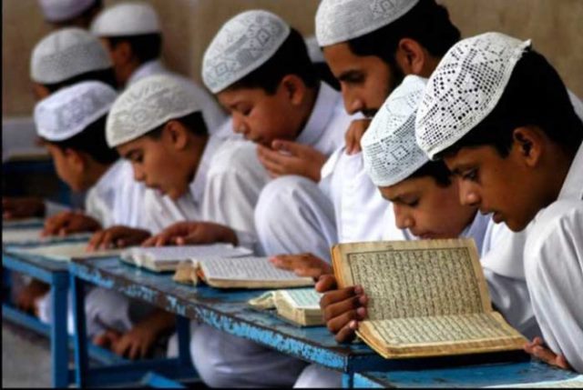 Students studying Quran